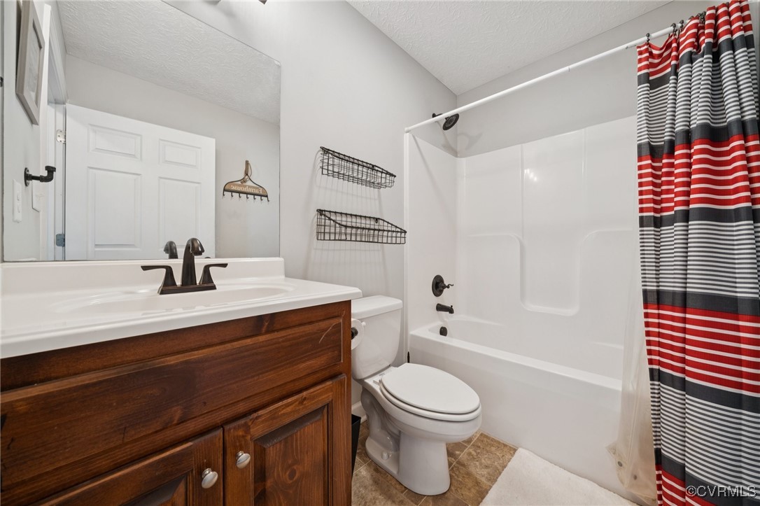 241 Deep Landing Road Tappahannock, VA 22560 - Photo 24 of 33 Bathroom with toilet, vanity, shower / tub combo,