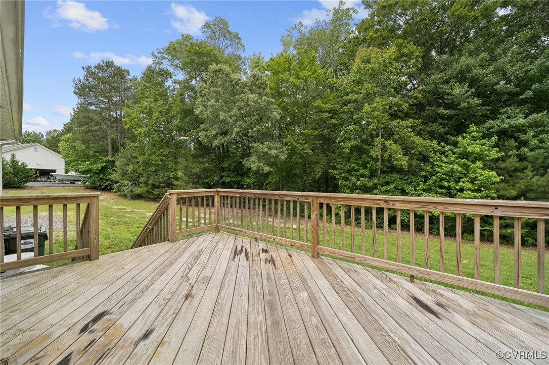 241 Deep Landing Road Tappahannock, VA 22560 - Photo 30 of 33 Deck featuring a lawn and view of scattered trees