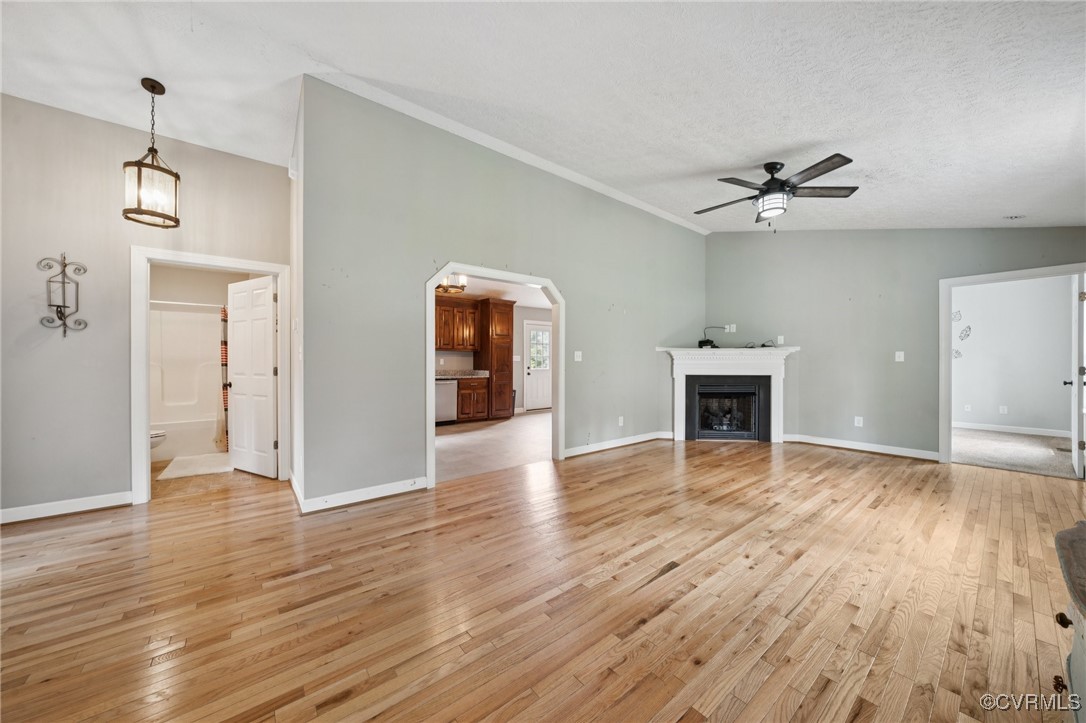 241 Deep Landing Road Tappahannock, VA 22560 - Photo 3 of 33 Unfurnished living room with light wood finished f