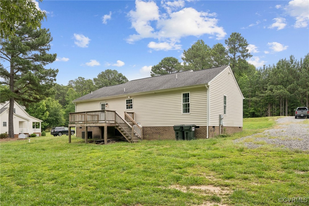 241 Deep Landing Road Tappahannock, VA 22560 - Photo 33 of 33 Back of house featuring a wooden deck, a yard, cra