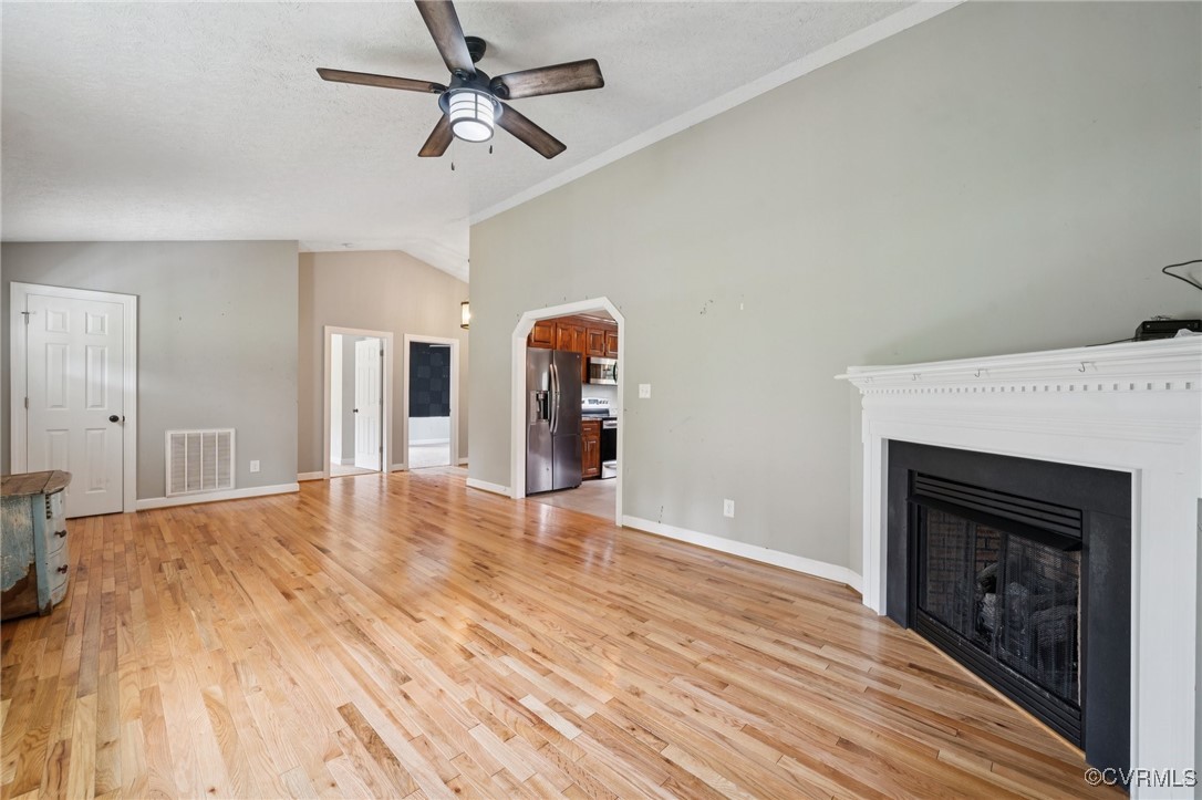 241 Deep Landing Road Tappahannock, VA 22560 - Photo 6 of 33 Unfurnished living room featuring lofted ceiling,