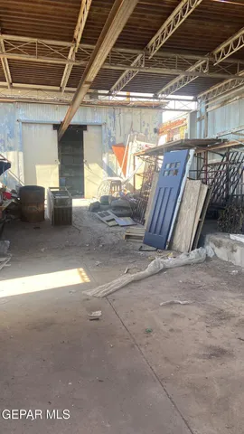 a view of a house with a small yard and floor to ceiling window