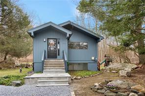 46 Lower Trinity Pass Road Pound Ridge, NY 10576 - Photo 1 of 1 a front view of a house with a yard