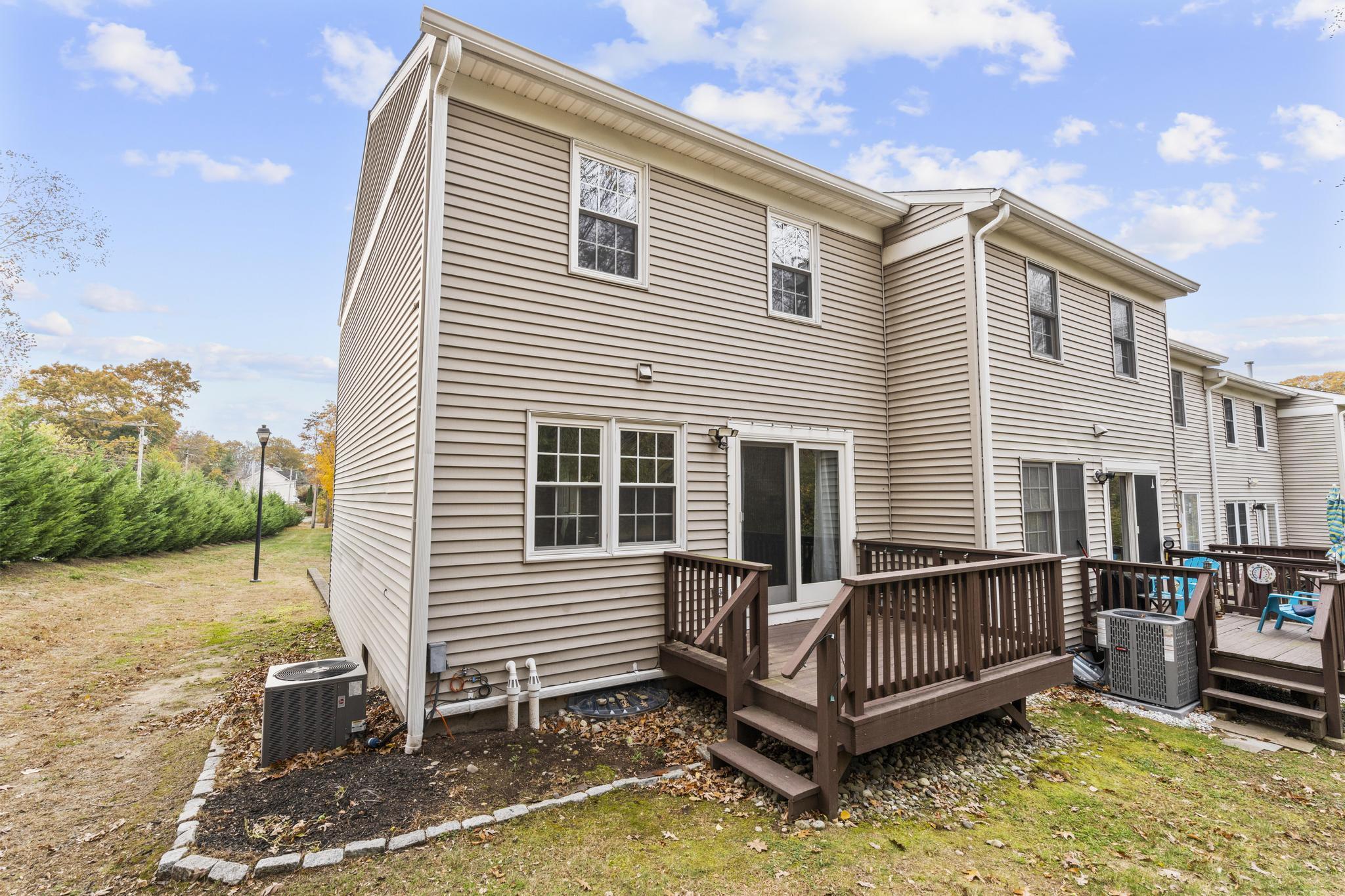 26 Summit Street, Unit 26 Derby, CT 06418 - Photo 11 of 35 a view of a house with wooden fence
