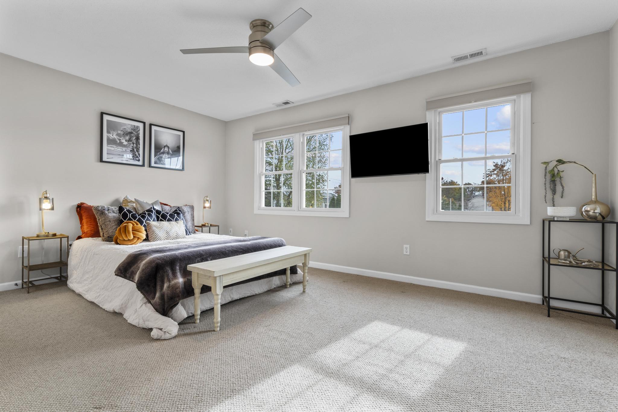 26 Summit Street, Unit 26 Derby, CT 06418 - Photo 29 of 35 a bedroom with a bed and a flat screen tv