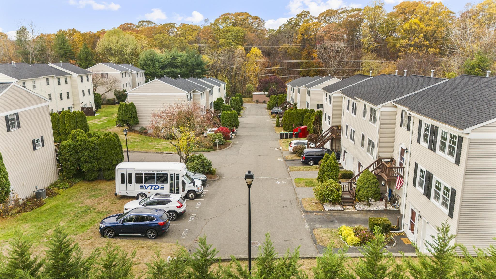 26 Summit Street, Unit 26 Derby, CT 06418 - Photo 6 of 35 a view of a swimming pool with a patio and a garden