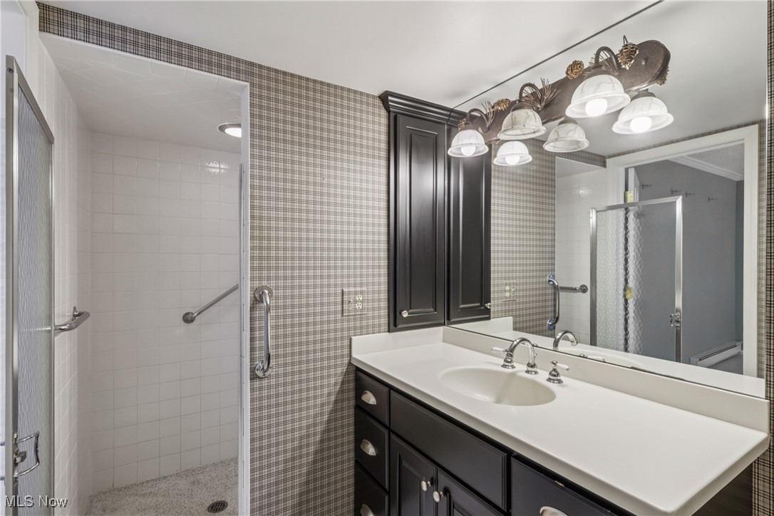 2375 Covington Road, Unit 311 Akron, OH 44313 - Photo 27 of 43 Bathroom with vanity and a shower stall