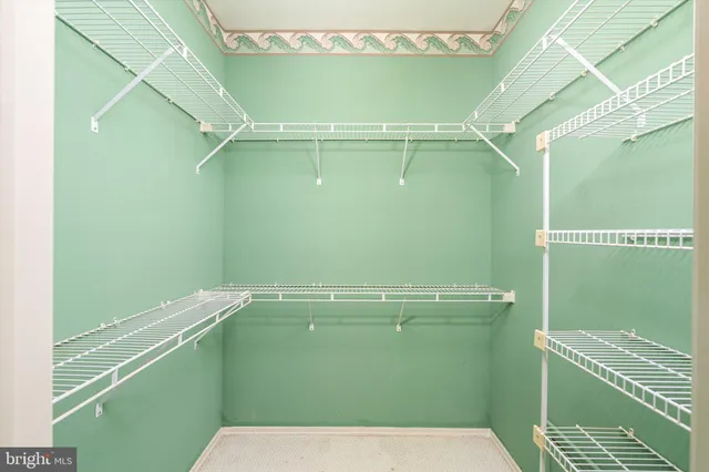 a bathroom with a granite countertop sink and a bathtub