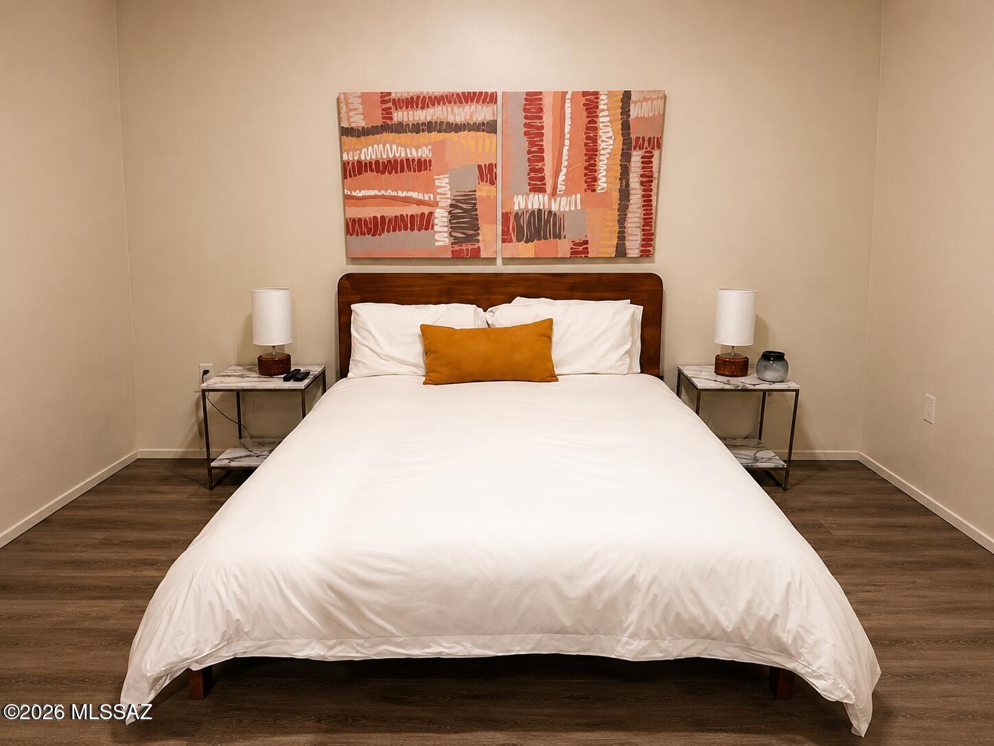 2018 East River Road, Unit 102 Tucson, AZ 85718 - Photo 19 of 25 a bedroom with a bed and wooden floor