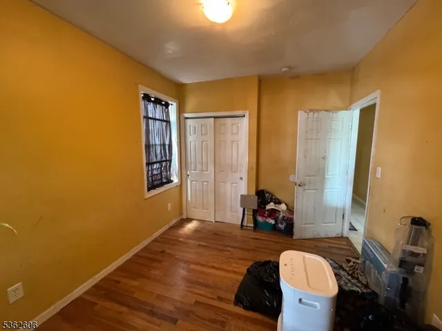 a living room with furniture and large windows