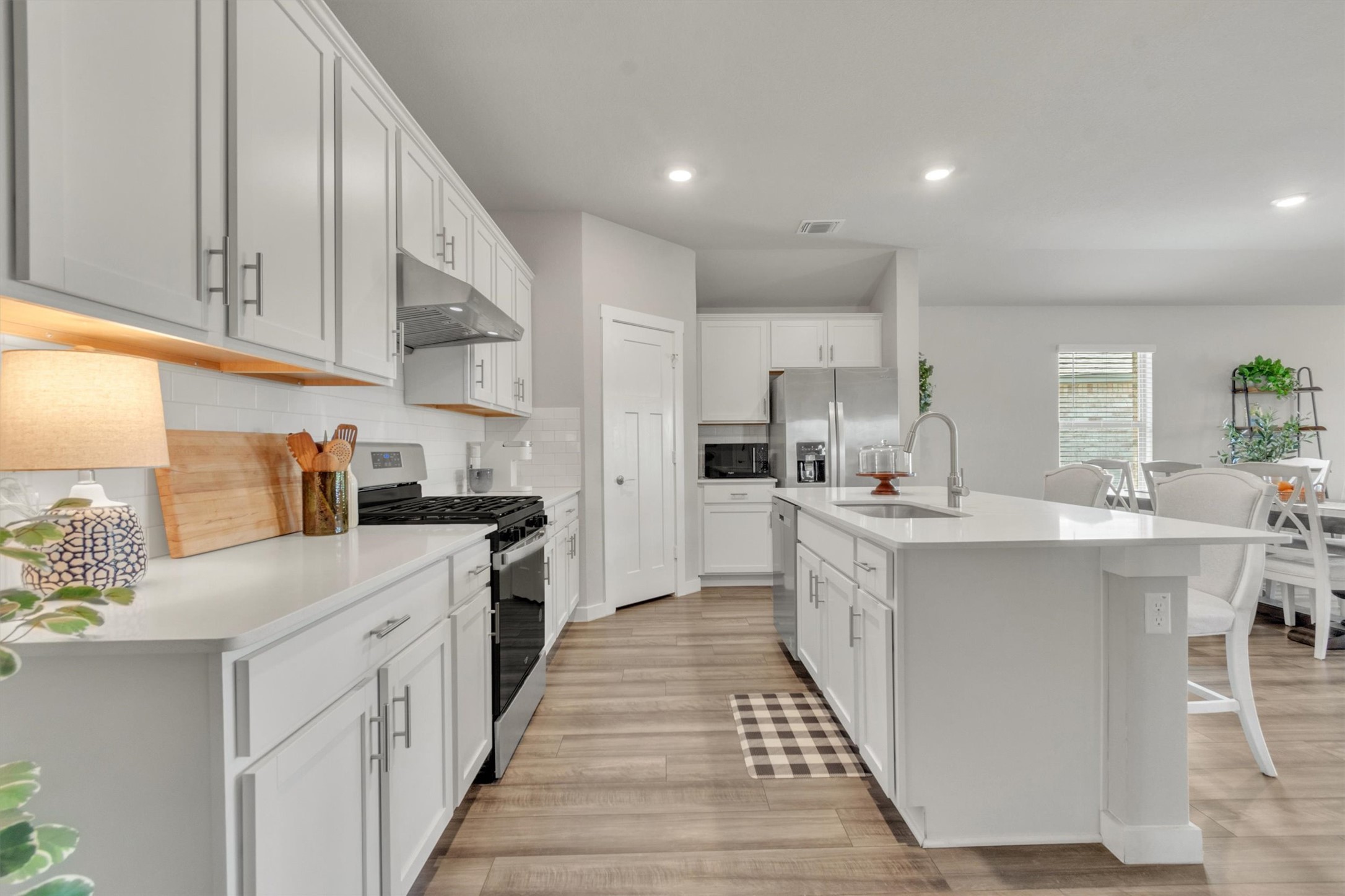 1008 Tipton Street Georgetown, TX 78633 - Photo 5 of 39 a kitchen with stainless steel appliances kitchen island granite countertop a sink and cabinets