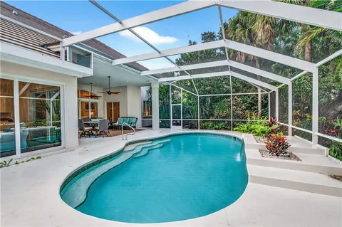 a view of a swimming pool with a patio