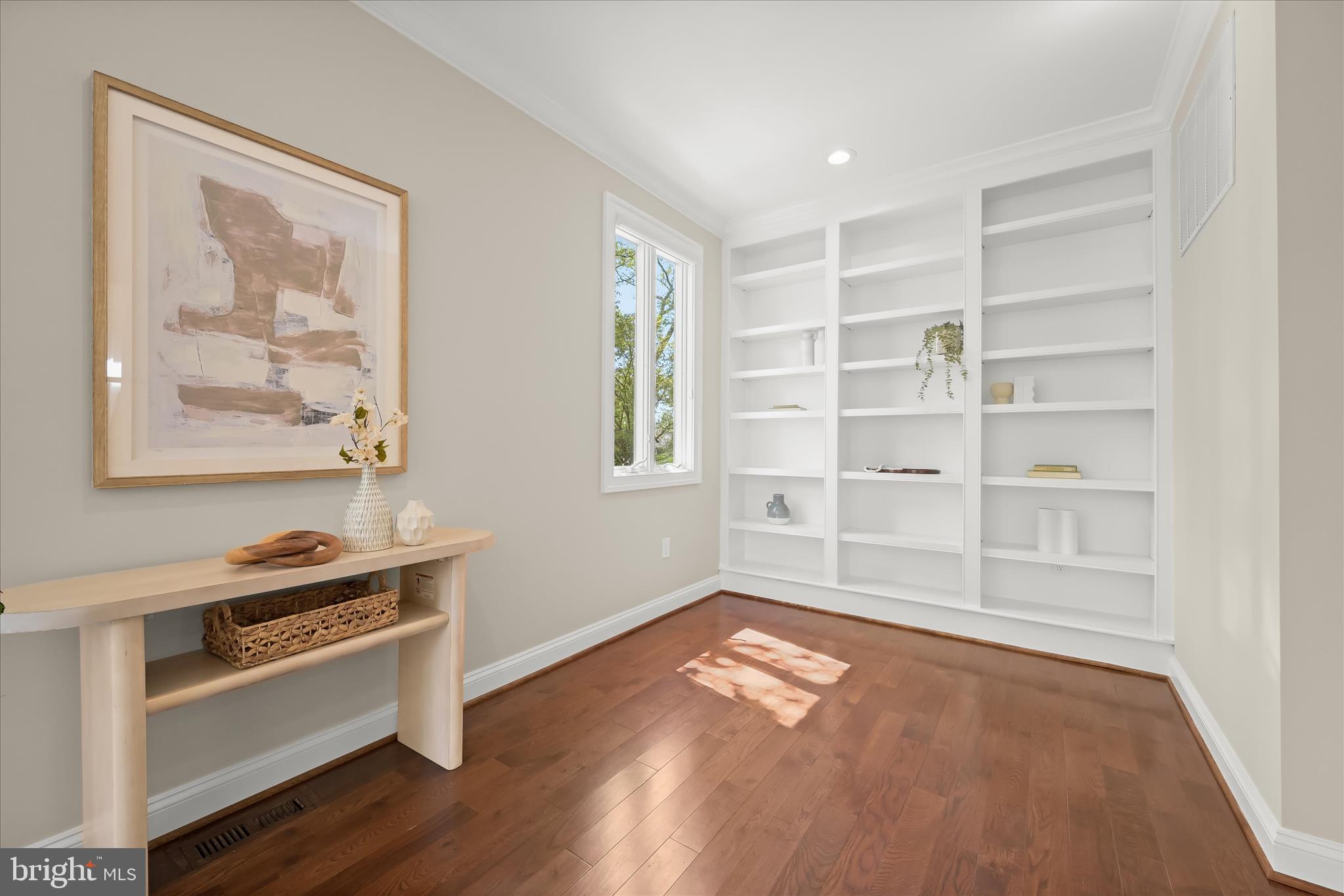 620 Jumpers Hole Road Severna Park, MD 21146 - Photo 18 of 112 a view of an empty room with a window and wooden floor