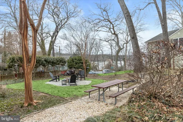 a view of a park with bench and sitting area