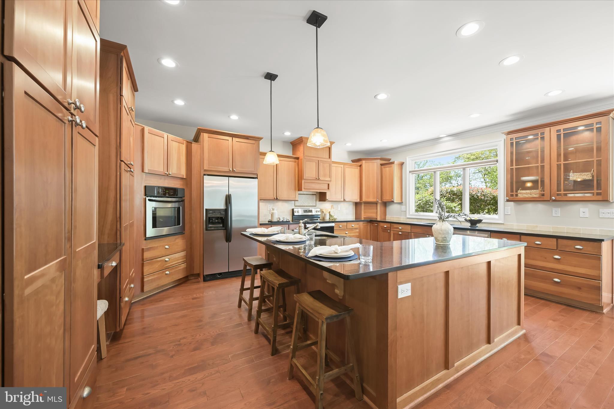 620 Jumpers Hole Road Severna Park, MD 21146 - Photo 22 of 112 a kitchen with stainless steel appliances granite countertop a sink a stove and a refrigerator