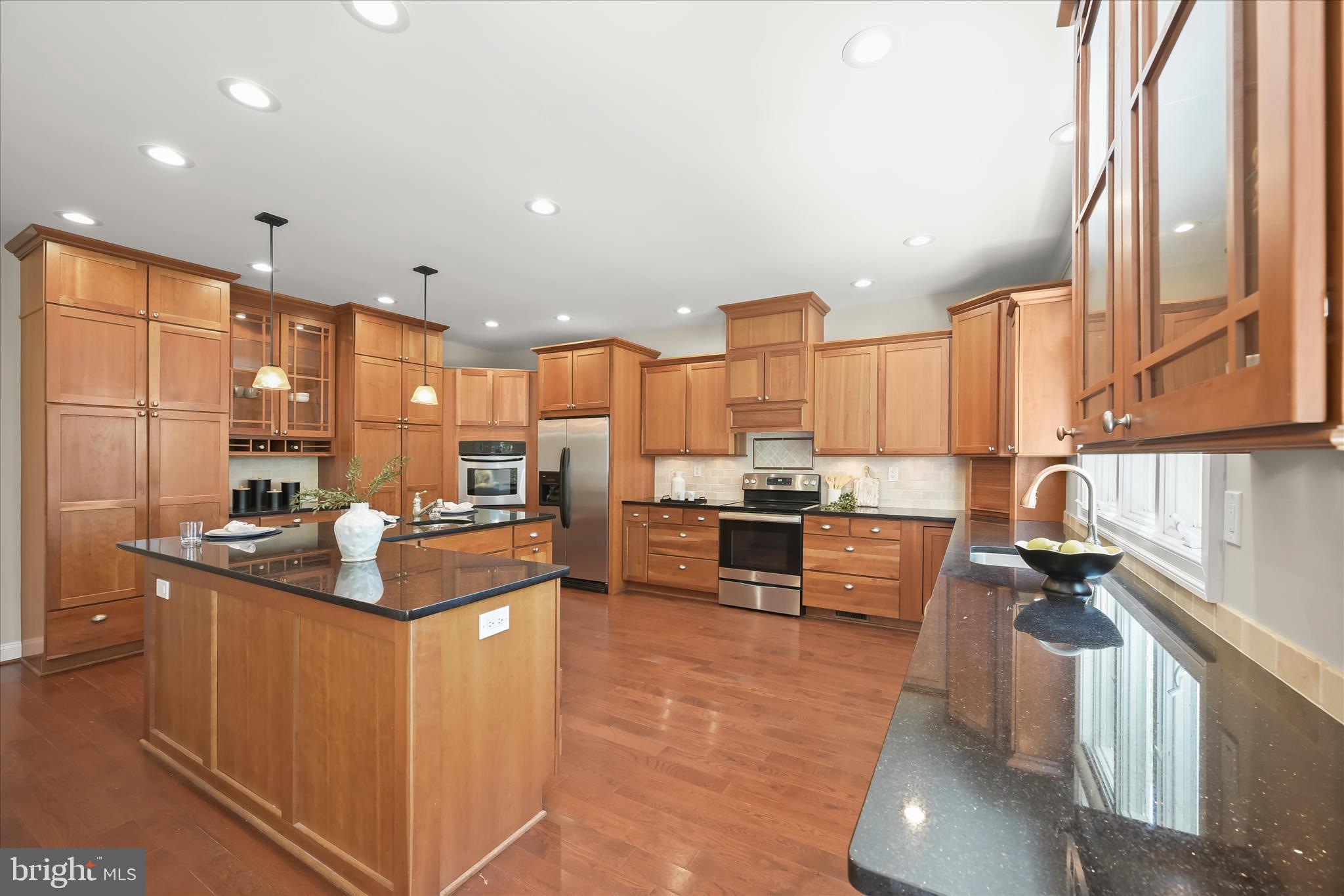 620 Jumpers Hole Road Severna Park, MD 21146 - Photo 28 of 112 a kitchen with kitchen island granite countertop a sink counter top space and stainless steel appliances