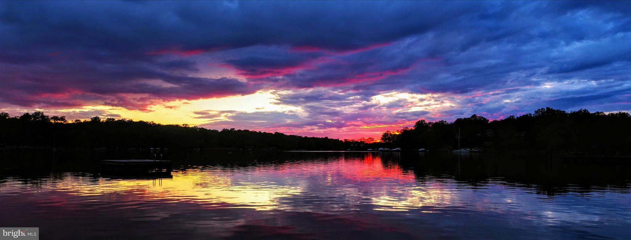 620 Jumpers Hole Road Severna Park, MD 21146 - Photo 33 of 43 a view of swimming pool with sunset in background