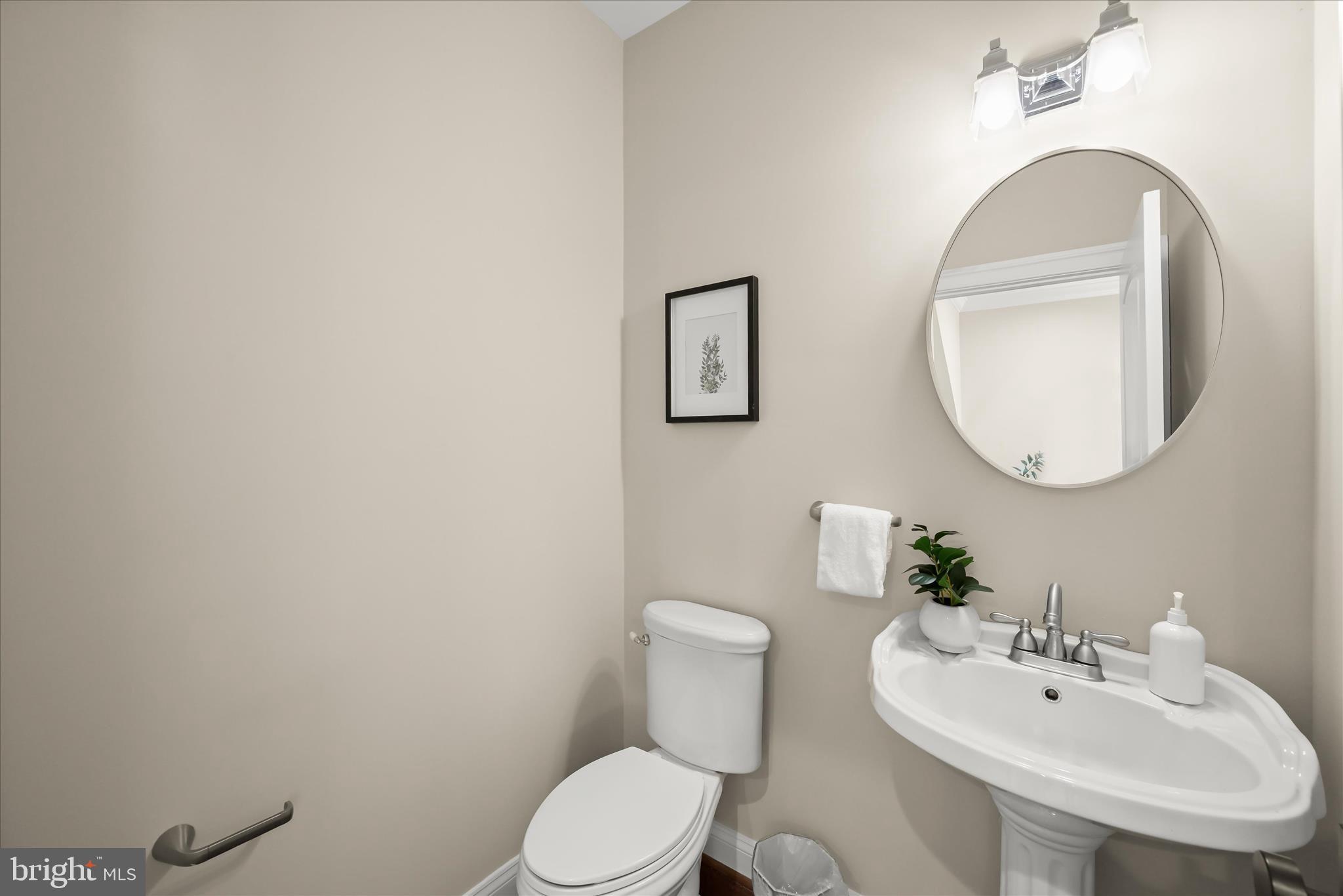620 Jumpers Hole Road Severna Park, MD 21146 - Photo 40 of 112 a bathroom with a toilet a sink and mirror