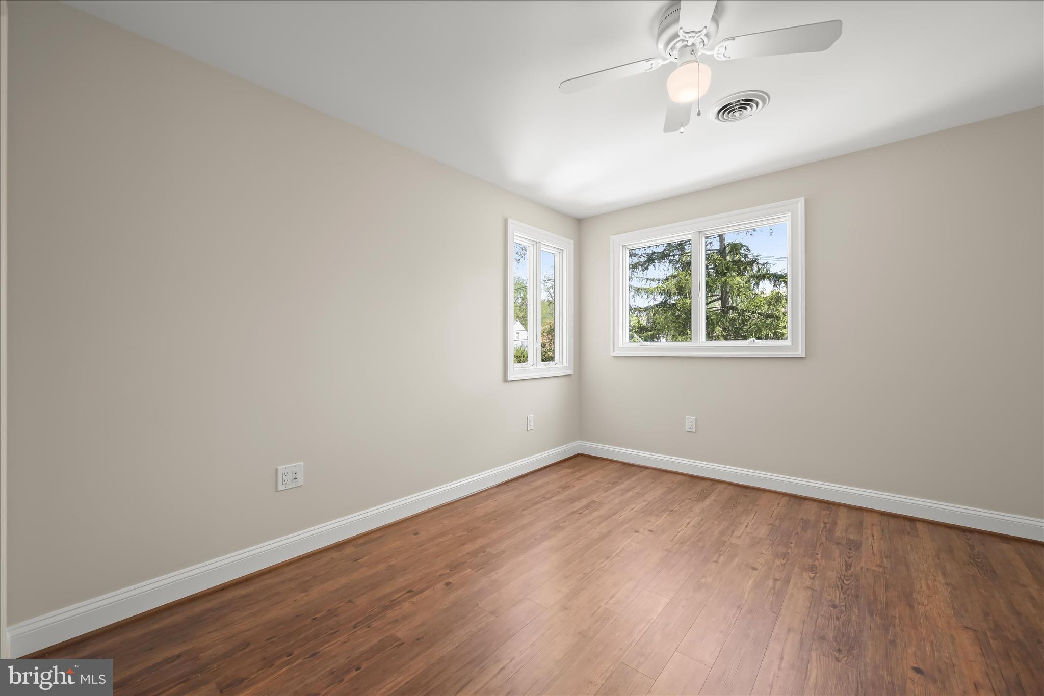 620 Jumpers Hole Road Severna Park, MD 21146 - Photo 55 of 112 a view of an empty room with wooden floor and a window