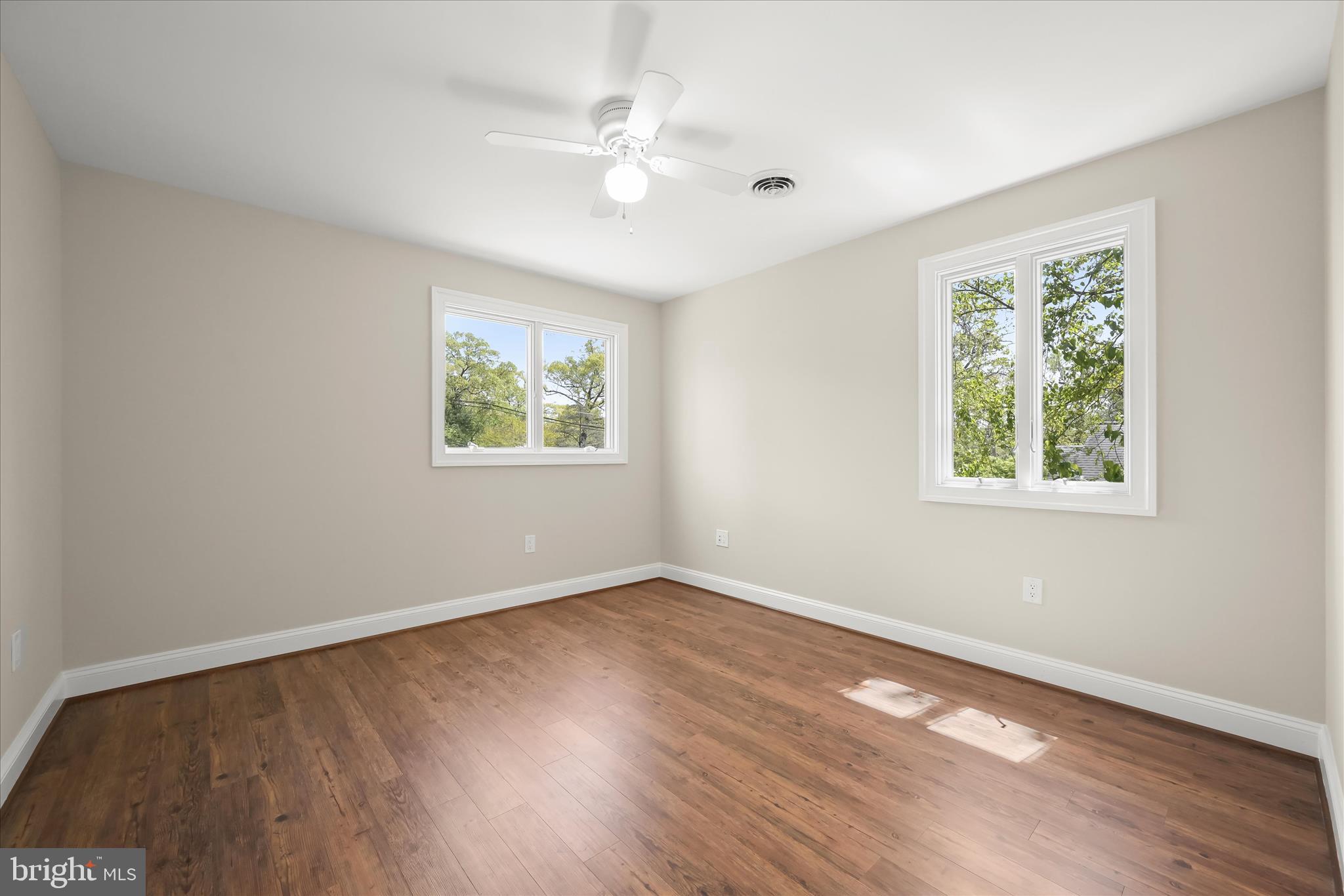 620 Jumpers Hole Road Severna Park, MD 21146 - Photo 59 of 112 a view of an empty room with wooden floor and window