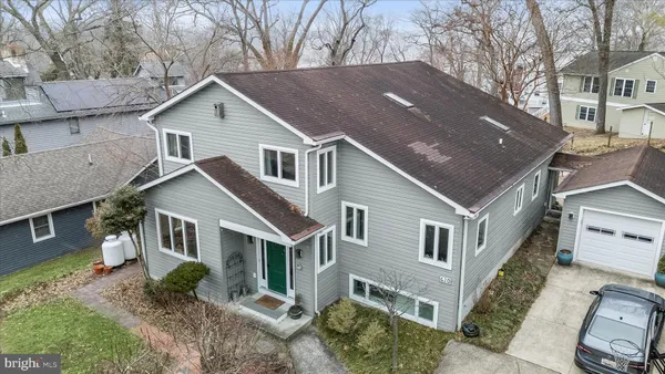 a aerial view of a house with a yard