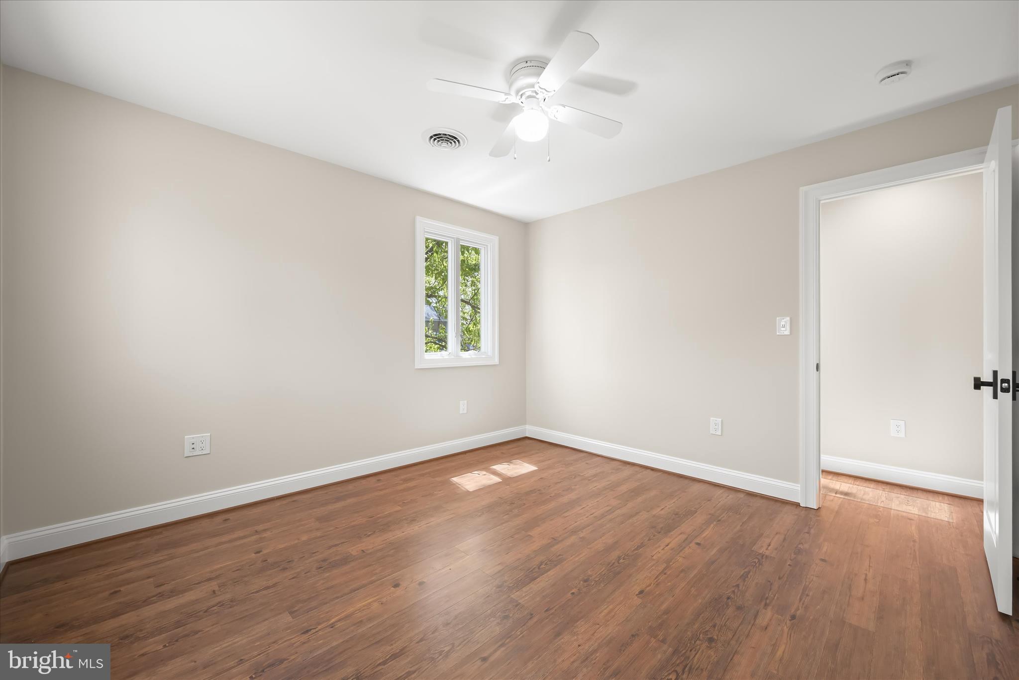 620 Jumpers Hole Road Severna Park, MD 21146 - Photo 61 of 112 an empty room with wooden floor and windows