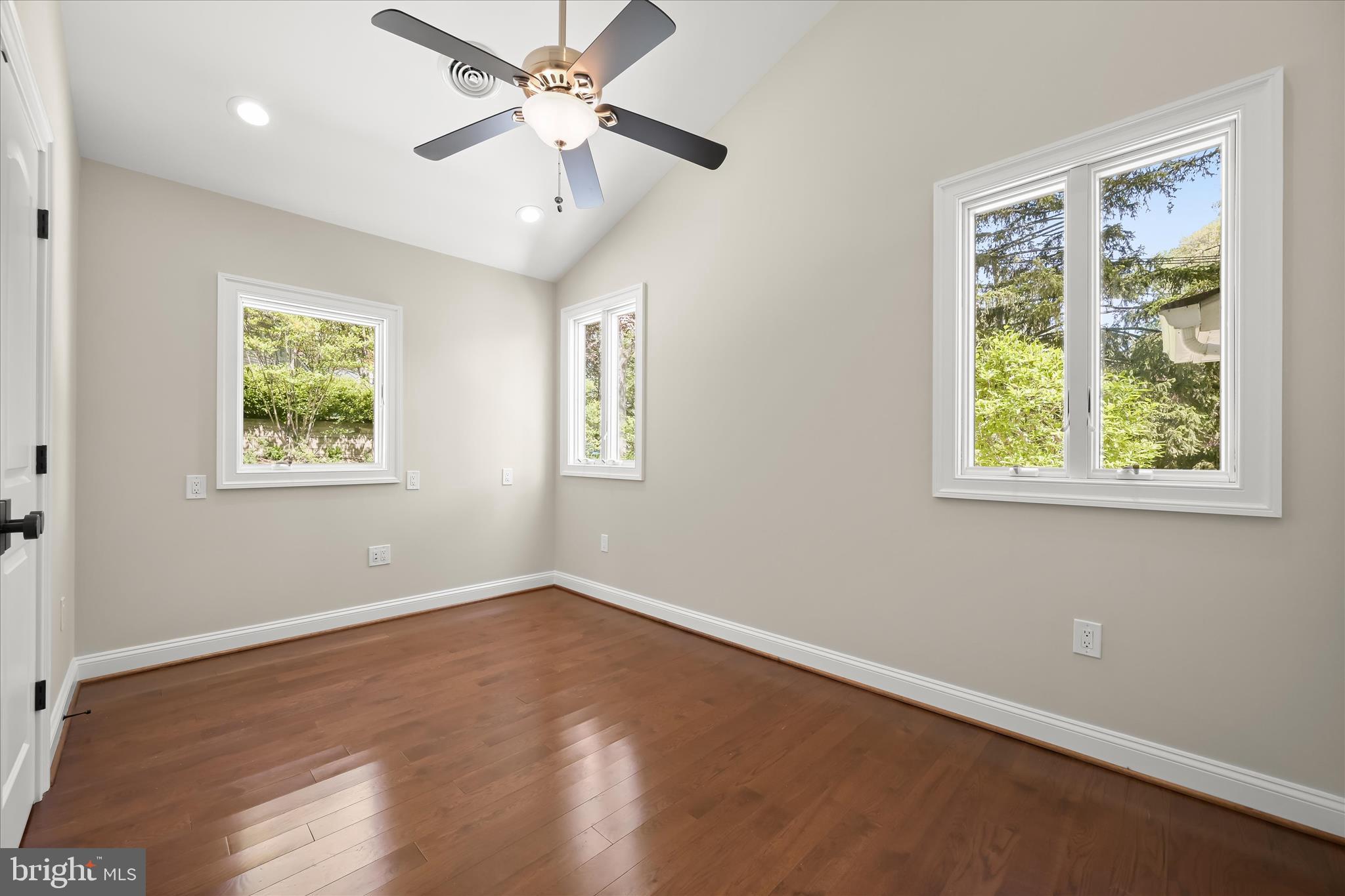 620 Jumpers Hole Road Severna Park, MD 21146 - Photo 71 of 112 a view of an empty room with a window and wooden floor