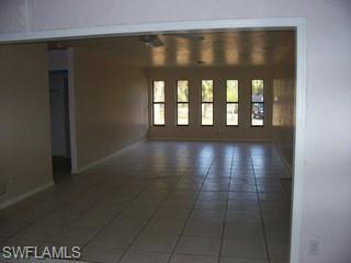 360 16th Avenue Northwest Naples, FL 34120 - Photo 2 of 6 a view of wooden floor in a hall