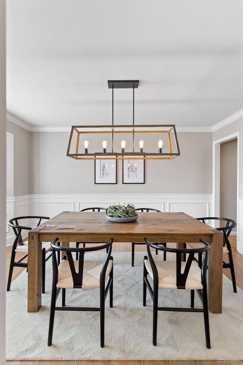6681 Secrest Circle Arvada, CO 80007 - Photo 11 of 50 a view of a table and chairs in a room
