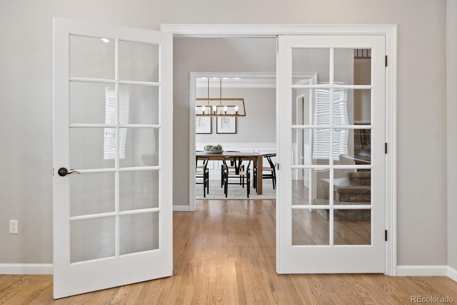 6681 Secrest Circle Arvada, CO 80007 - Photo 25 of 50 a view of a livingroom with wooden floor and windows