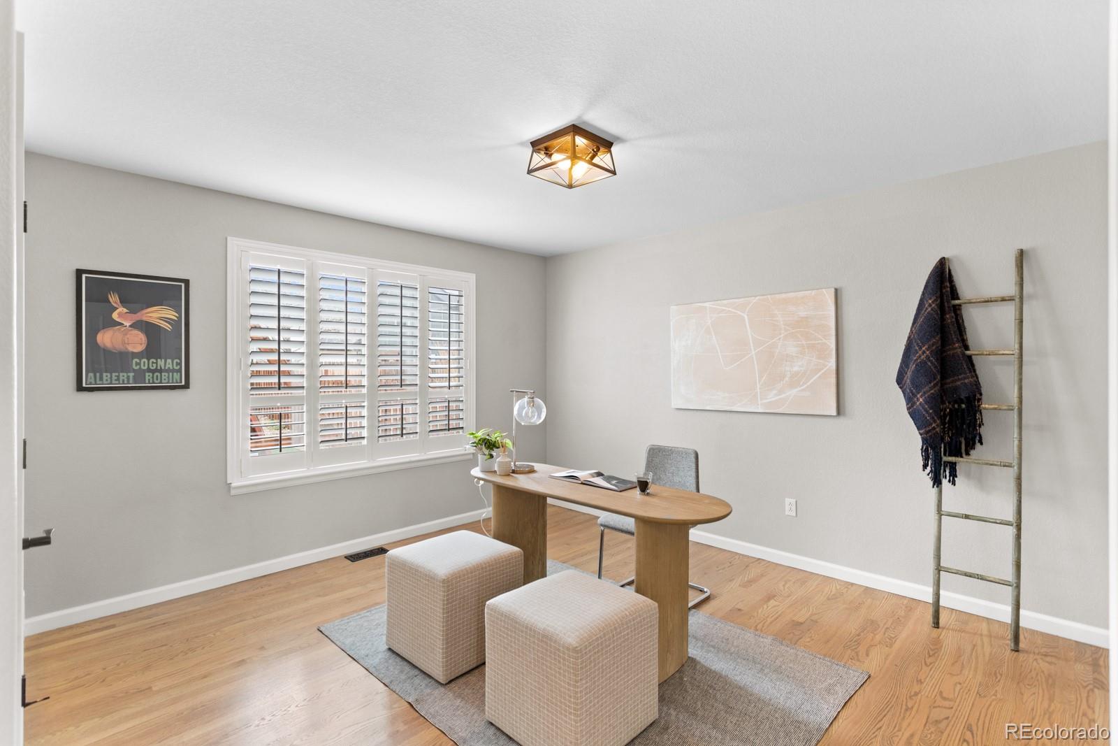 6681 Secrest Circle Arvada, CO 80007 - Photo 27 of 50 a living room with furniture and a window