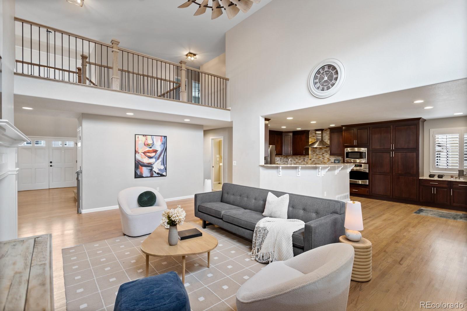 6681 Secrest Circle Arvada, CO 80007 - Photo 3 of 50 a living room with furniture and kitchen view