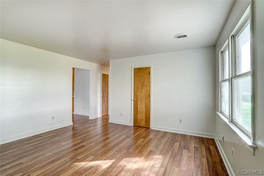 2820 Congress Road North Chesterfield, VA 23237 - Photo 8 of 37 a view of an empty room with wooden floor and a window