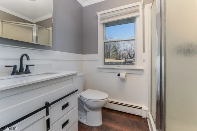 a bathroom with a toilet and a sink