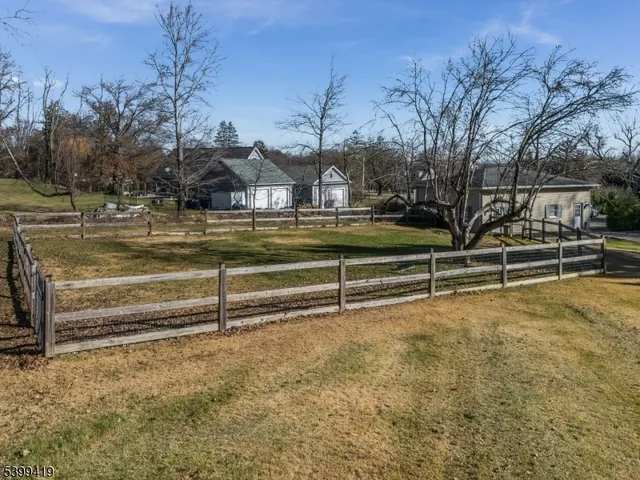 a bathroom with a swimming pool and trees