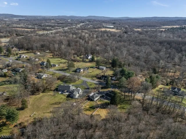 a view of a house with backyard and garden