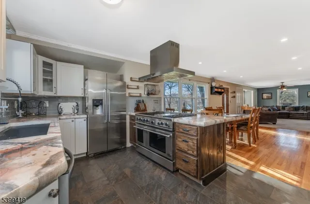 a kitchen with a stove and a refrigerator