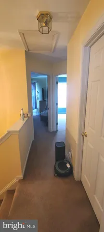 a bathroom with a sink a vanity and a large mirror