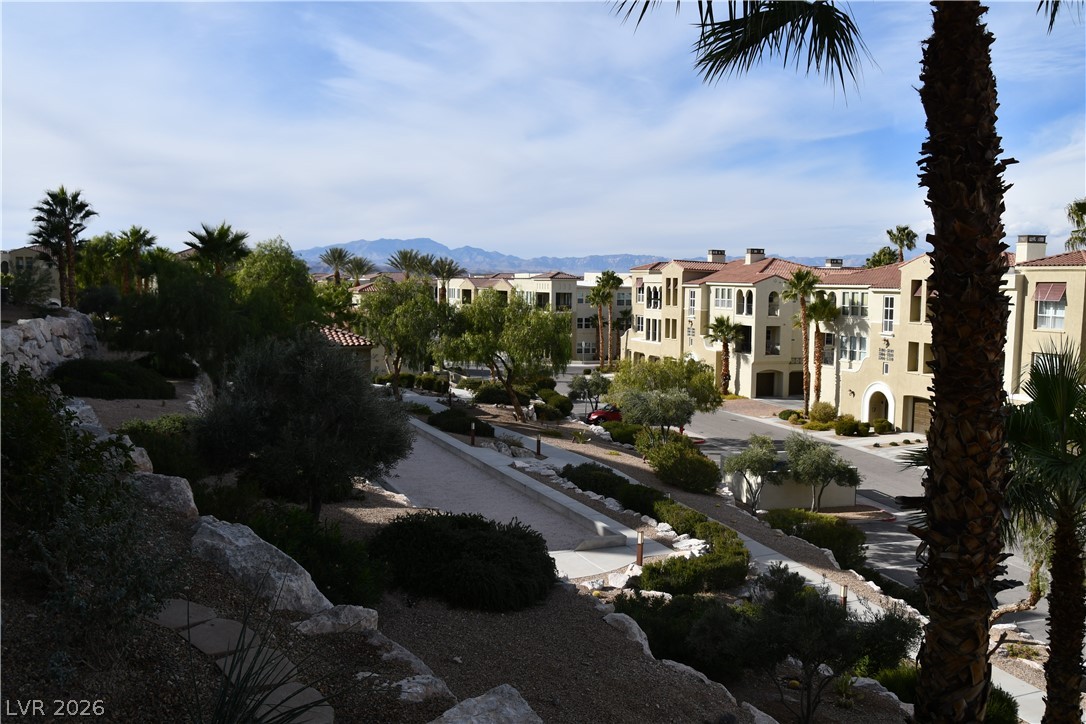 2555 Hampton Road, Unit 7109 Henderson, NV 89052 - Photo 11 of 34 Mediterranean-inspired multi-family complex nestled among desert landscaping with distant mountain views.