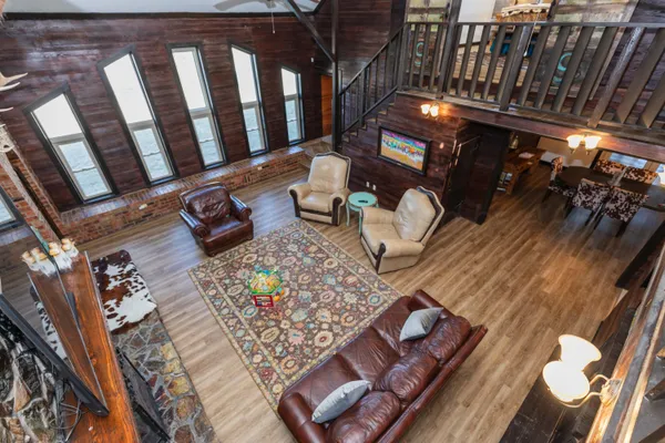 a room with a bed and wooden floor