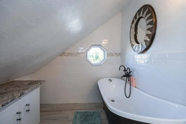 a view of a chairs and table in the patio