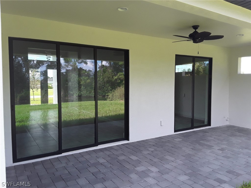 478 Rajah Street Lehigh Acres, FL 33974 - Photo 3 of 13 a view of an empty room with a balcony