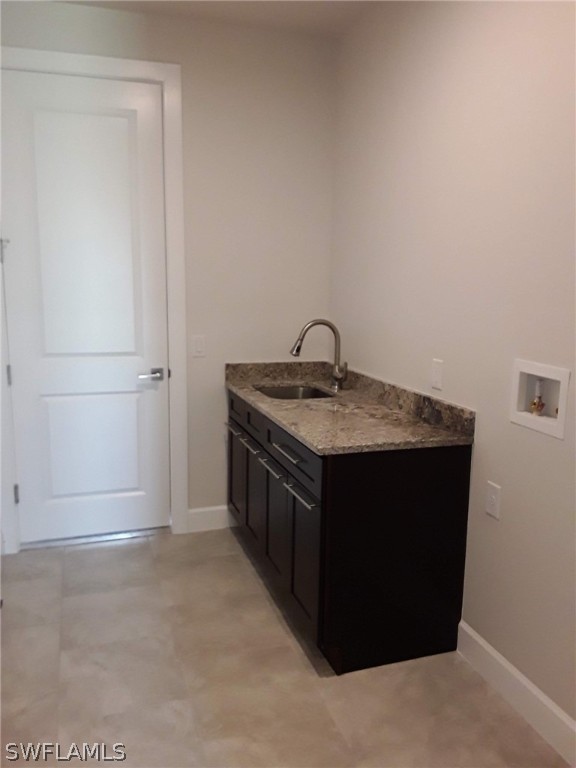 478 Rajah Street Lehigh Acres, FL 33974 - Photo 8 of 13 a kitchen with a sink and a mirror
