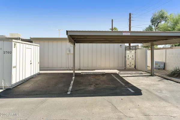 a view of a house with a backyard and sitting area
