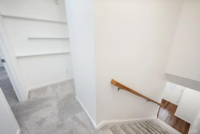 a view of bedroom with a bed and cabinets