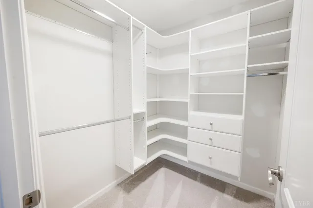a view of an empty walk in closet