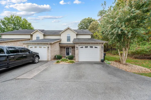 a view of a car parked in front of a house