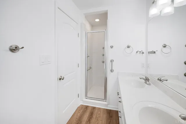 a bathroom with a sink and shower