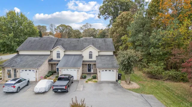 an aerial view of a house with parking area