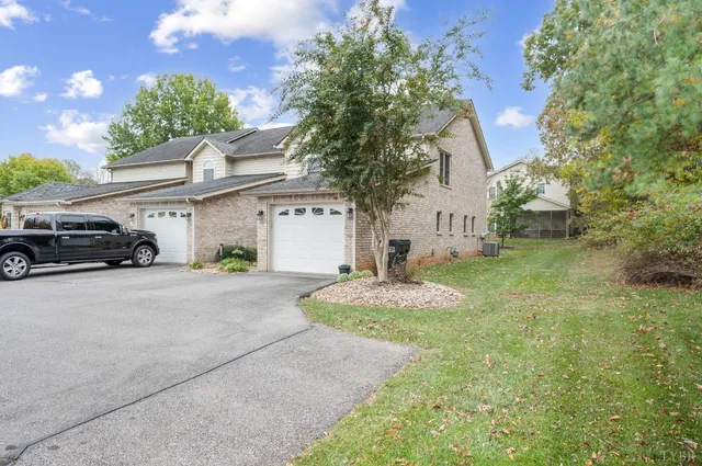 a view of a car parked in front of a house